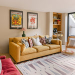 The Roller XL reversible memory foam playmat by Totter + Tumble, the largest one piece playmat on the market in a bright modern living space
