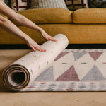The Roller XL reversible memory foam playmat by Totter + Tumble, the largest one piece playmat on the market rolled with The Wildcard underneath