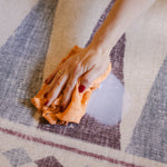Milk wipe on The Roller XL reversible memory foam playmat by Totter + Tumble, the largest one piece playmat on the market