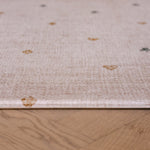 Close-up edge of The Wildcard XL reversible memory foam playmat by Totter + Tumble, the largest one piece playmat on the market