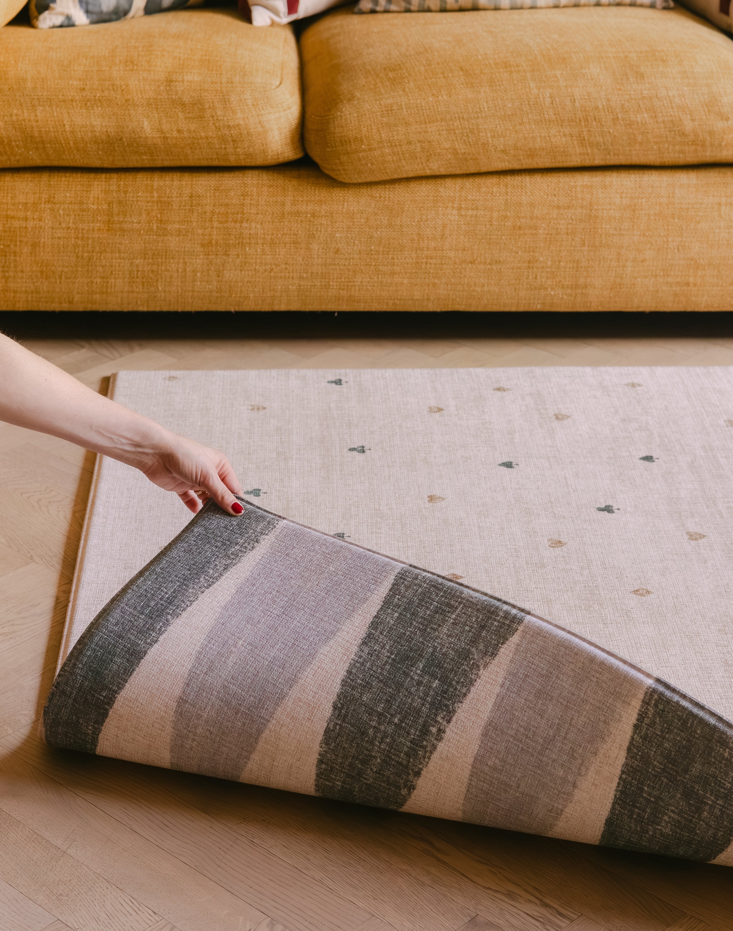 The Wildcard Totter + Tumble reversible memory foam playmat rolling back to reveal The Counter 