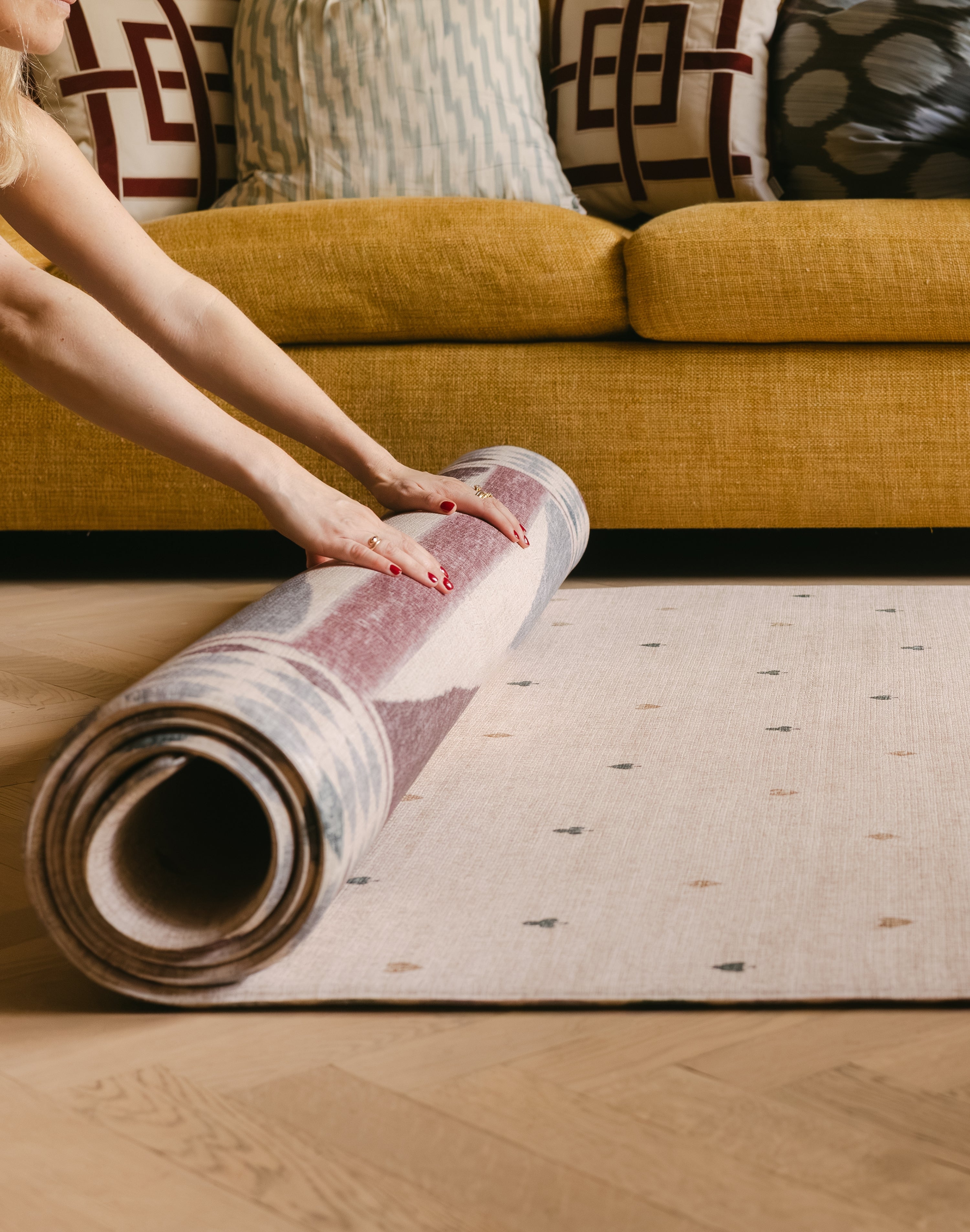 The Wildcard XL reversible memory foam playmat by Totter + Tumble, the largest one piece playmat on the market, rolled into The Roller